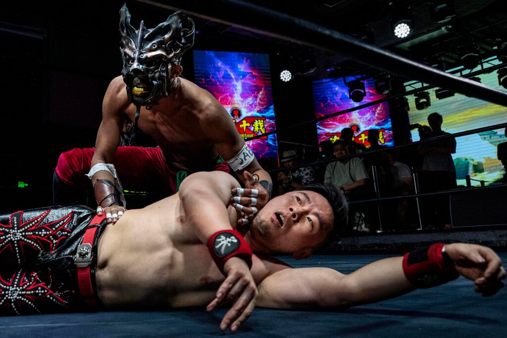 With kung fu kicks and dragon masks, pro wrestlers find new fans at fight night in China