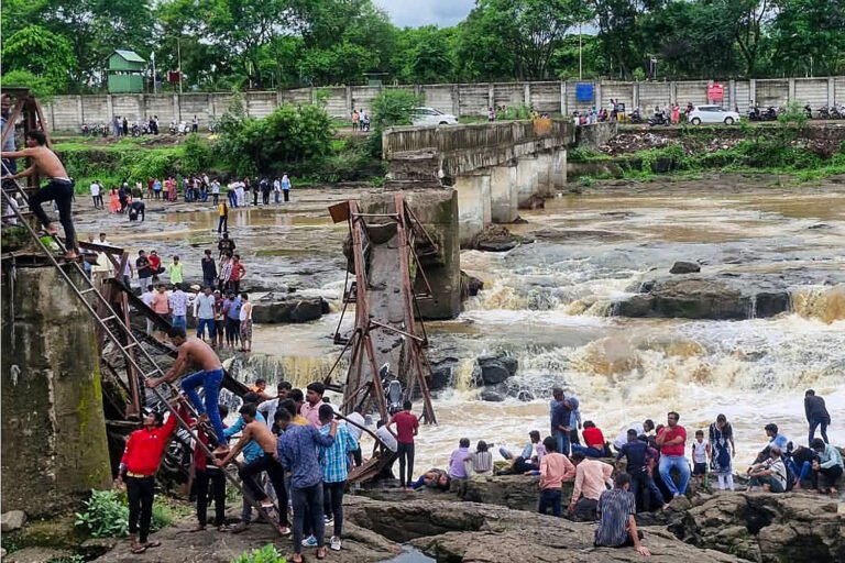 2 killed and 32 injured when a bridge collapses at a tourist destination in western India