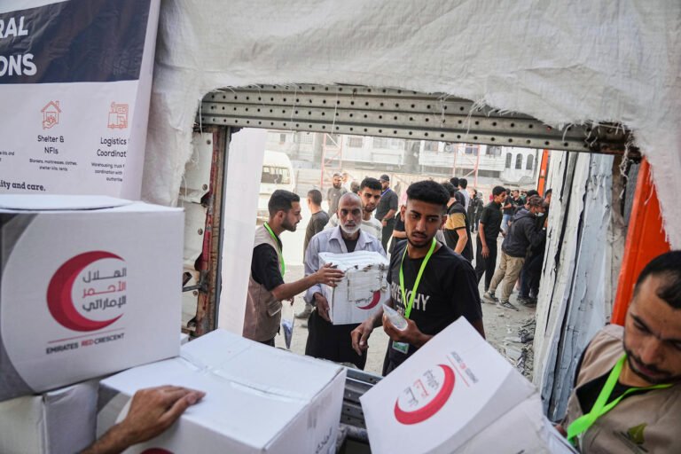 Israel halts aid, official says, as Palestinian clans in Gaza deny Hamas is stealing it