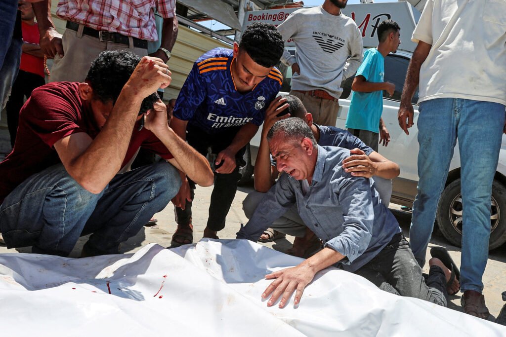 An Israeli strike kills 18 Palestinians in central Gaza as turmoil mounts over food distribution An Israeli strike kills 18 Palestinians in central Gaza as turmoil mounts over food distribution